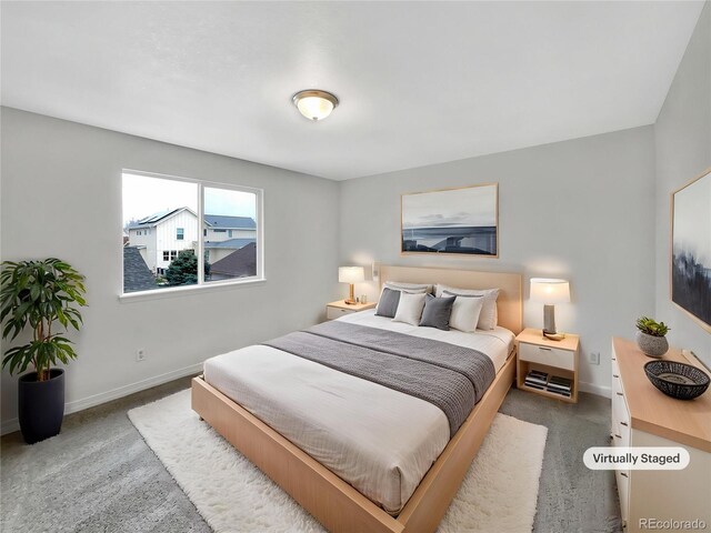 carpeted bedroom with baseboards