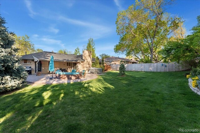 view of yard with a patio and fence