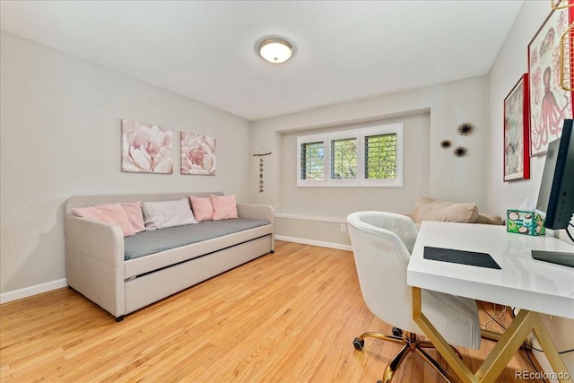 office with baseboards and wood finished floors