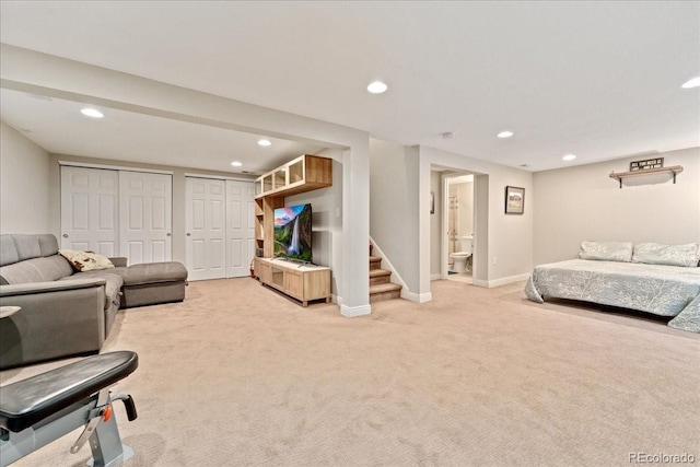 living room with light carpet, stairs, baseboards, and recessed lighting