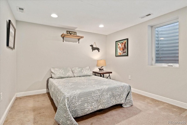 carpeted bedroom featuring recessed lighting, visible vents, and baseboards