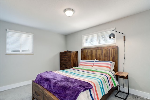 carpeted bedroom with baseboards