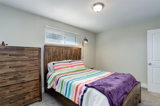 carpeted bedroom with baseboards