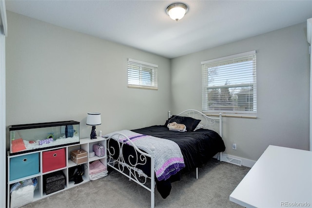 bedroom with visible vents and carpet floors