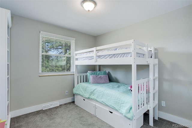 bedroom with carpet floors, baseboards, and visible vents