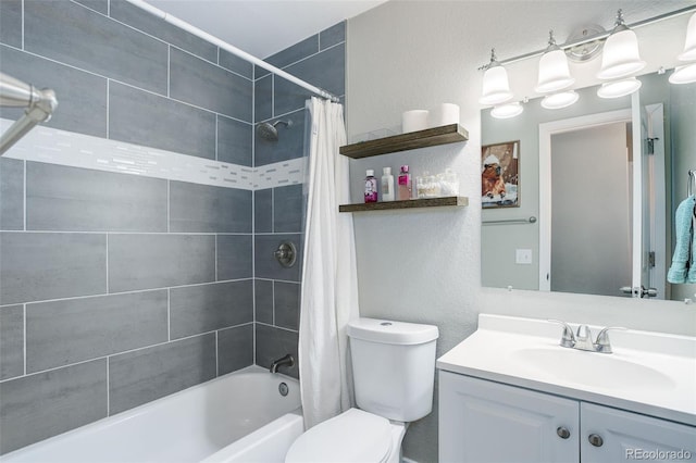 full bathroom featuring vanity, a textured wall, shower / bath combo, and toilet