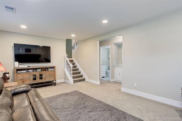 living room with light colored carpet, stairs, recessed lighting, baseboards, and visible vents