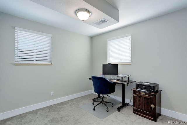 home office featuring carpet floors, baseboards, and visible vents