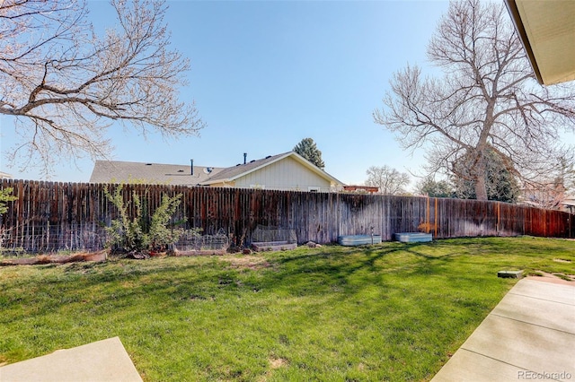 view of yard featuring a fenced backyard