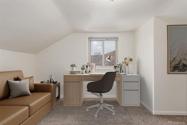 home office with light carpet, baseboards, vaulted ceiling, and a textured ceiling