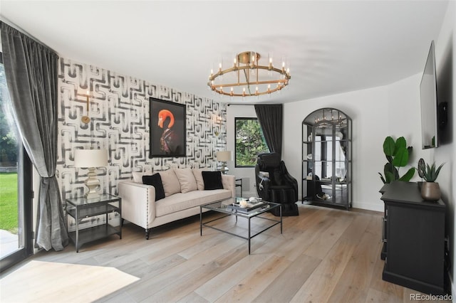 living room featuring light hardwood / wood-style floors and a chandelier