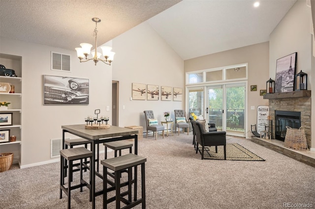 23585 Genesee Village Rd Unit E, Golden, CO 80401 - carpeted dining area with a chandelier, high vaulted ceiling, and a stone fireplace