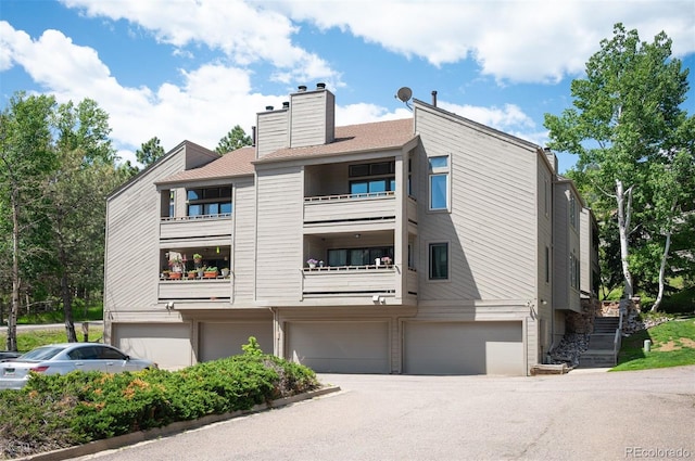 23585 Genesee Village Rd Unit E, Golden, CO 80401 - view of property featuring an attached garage