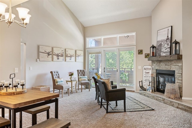 23585 Genesee Village Rd Unit E, Golden, CO 80401 - carpeted living room featuring a high ceiling, a chandelier, and a stone fireplace