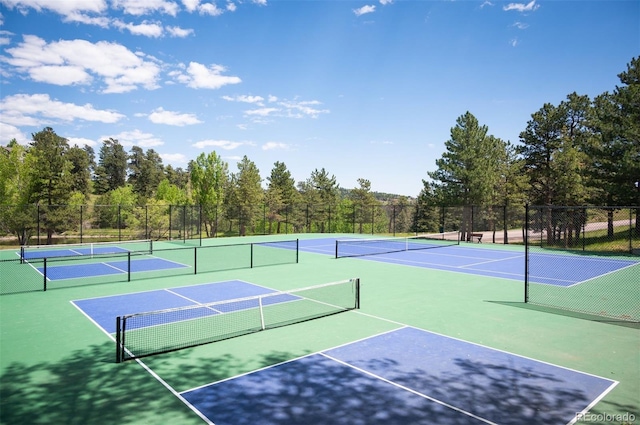 23585 Genesee Village Rd Unit E, Golden, CO 80401 - view of tennis court featuring community basketball court and a forest view
