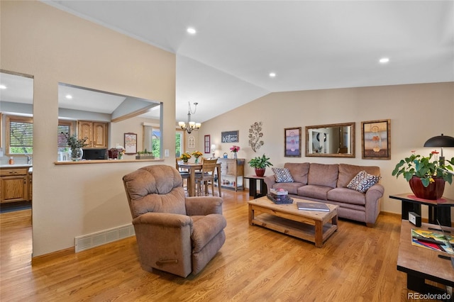 9700 W 88th Pl, Westminster, CO 80021 - living room with a chandelier, lofted ceiling, light wood-type flooring, and recessed lighting