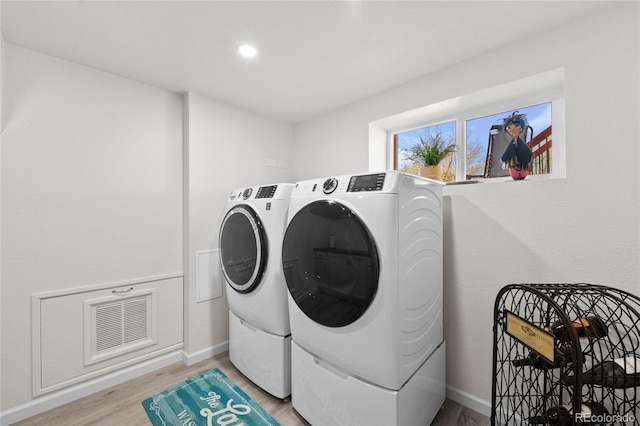 9700 W 88th Pl, Westminster, CO 80021 - laundry room with washing machine and dryer, light wood finished floors, baseboards, and recessed lighting