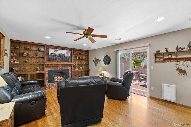 9700 W 88th Pl, Westminster, CO 80021 - living room featuring a ceiling fan, light wood-style floors, a brick fireplace, recessed lighting, and baseboards