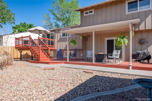 9700 W 88th Pl, Westminster, CO 80021 - back of house featuring board and batten siding, a deck, and stairs