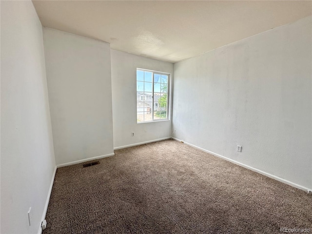 2033 Espana Way, Aurora, CO 80011 - empty room with carpet floors and baseboards