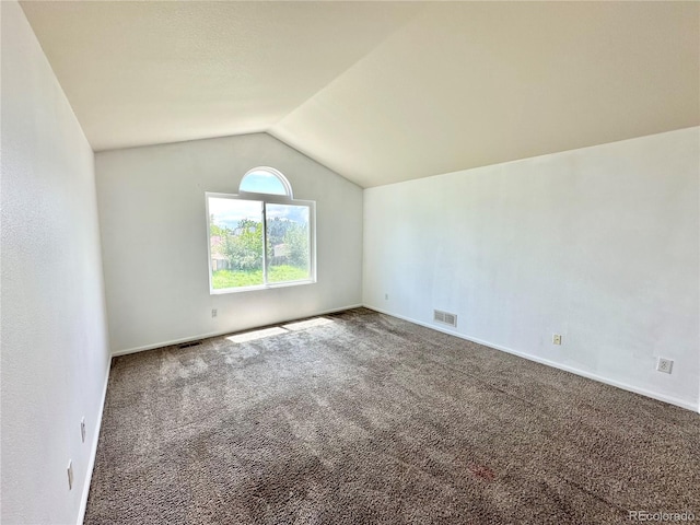 2033 Espana Way, Aurora, CO 80011 - additional living space with carpet flooring, vaulted ceiling, and baseboards