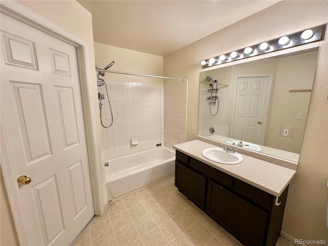 2033 Espana Way, Aurora, CO 80011 - bathroom with vanity, shower / washtub combination, and a textured ceiling
