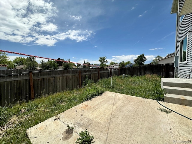 2033 Espana Way, Aurora, CO 80011 - fenced backyard with a patio