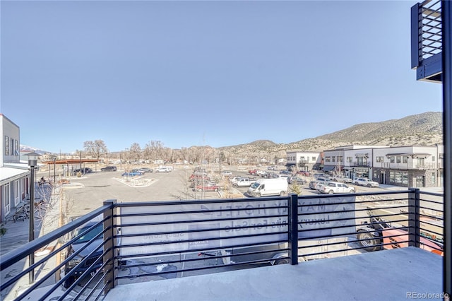 balcony featuring a mountain view