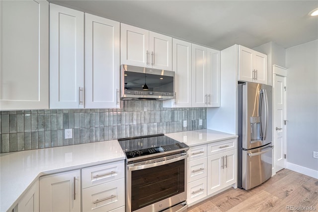 kitchen featuring light wood finished floors, light countertops, appliances with stainless steel finishes, and white cabinets