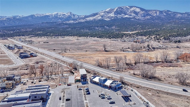 drone / aerial view featuring a mountain view