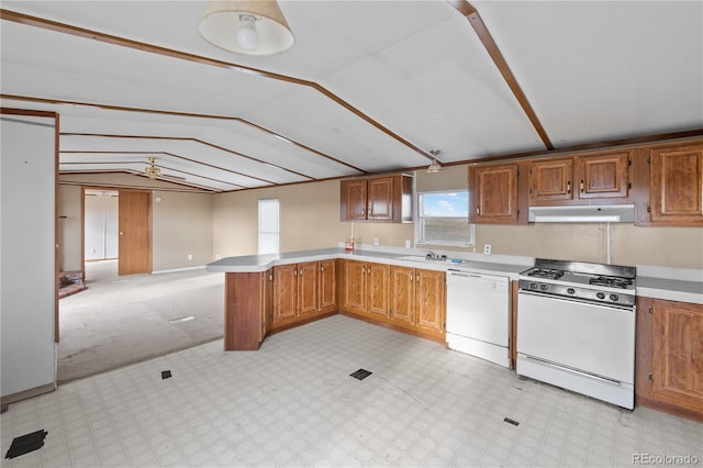 35275 Book Rd, Yoder, CO 80864 - kitchen featuring white appliances, under cabinet range hood, vaulted ceiling, a peninsula, and light countertops