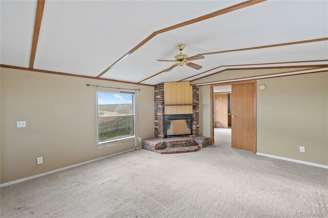 35275 Book Rd, Yoder, CO 80864 - unfurnished living room with a ceiling fan, a fireplace, vaulted ceiling, carpet, and baseboards