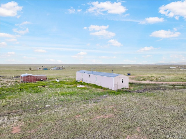 35275 Book Rd, Yoder, CO 80864 - view of yard with a rural view, an outdoor structure, and an outbuilding
