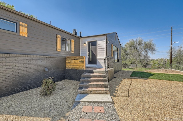 5555 Julian St, Denver, CO 80221 - view of front of home with brick siding and fence