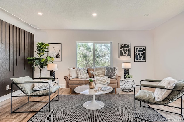 5555 Julian St, Denver, CO 80221 - living area featuring wood finished floors, recessed lighting, a textured ceiling, and baseboards