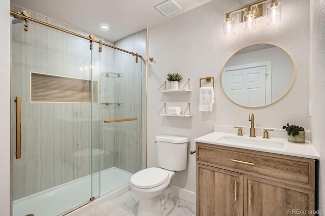 5555 Julian St, Denver, CO 80221 - bathroom featuring toilet, a stall shower, marble look tile flooring, and vanity