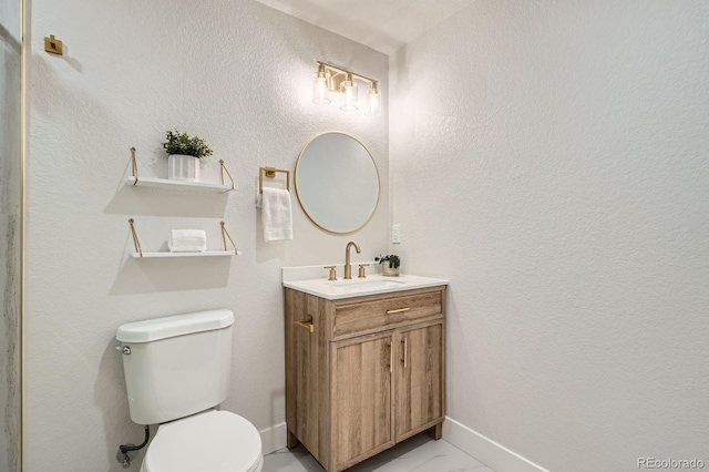 5555 Julian St, Denver, CO 80221 - bathroom featuring vanity, toilet, and marble look tiles