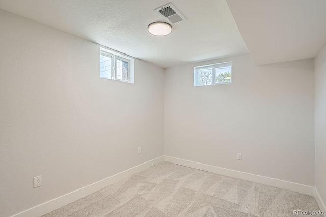 5555 Julian St, Denver, CO 80221 - below grade area featuring baseboards and light carpet