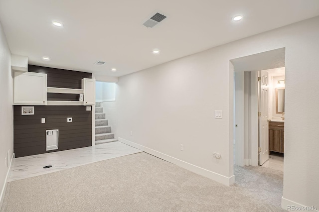 5555 Julian St, Denver, CO 80221 - unfurnished living room with stairway, baseboards, recessed lighting, and light carpet