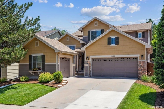 3102 Fox Sedge Pl, Highlands Ranch, CO 80126 - craftsman inspired home with driveway, an attached garage, a front lawn, stone siding, and roof with shingles