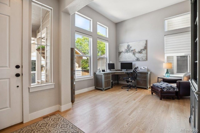 3102 Fox Sedge Pl, Highlands Ranch, CO 80126 - home office featuring wood finished floors and baseboards