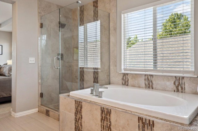 3102 Fox Sedge Pl, Highlands Ranch, CO 80126 - bathroom featuring a garden tub, a shower stall, connected bathroom, baseboards, and tile patterned floors