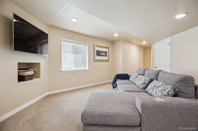 3102 Fox Sedge Pl, Highlands Ranch, CO 80126 - living room featuring carpet floors, baseboards, a textured ceiling, and recessed lighting