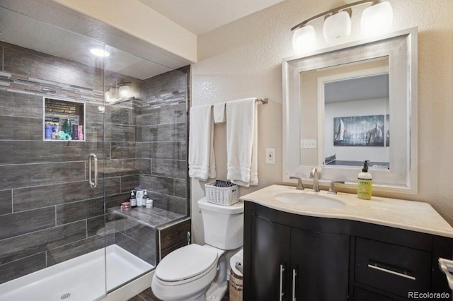 3102 Fox Sedge Pl, Highlands Ranch, CO 80126 - bathroom with vanity, toilet, and a stall shower