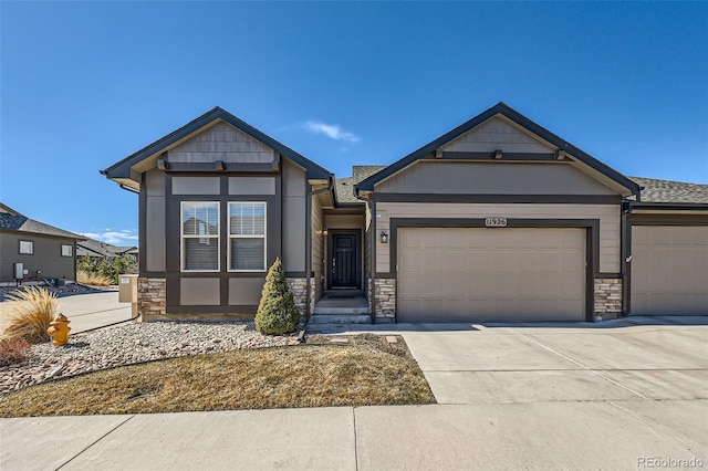 11926 Barrentine Loop, Parker, CO 80138 - craftsman-style home featuring concrete driveway, stone siding, a shingled roof, and a garage