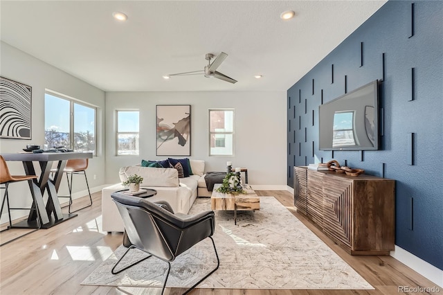 15290 W 69th Pl, Arvada, CO 80007 - living room featuring plenty of natural light, ceiling fan, light wood-style flooring, and recessed lighting
