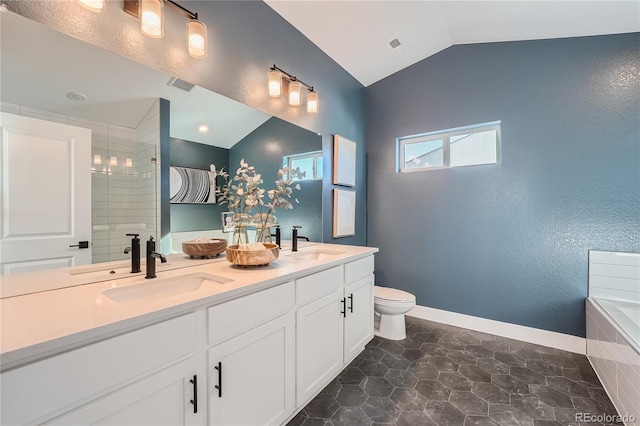 15290 W 69th Pl, Arvada, CO 80007 - bathroom with lofted ceiling, double vanity, and tiled tub