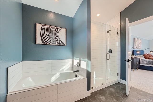 15290 W 69th Pl, Arvada, CO 80007 - full bath featuring a shower stall, ensuite bathroom, a garden tub, a textured wall, and lofted ceiling