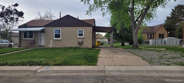 2880 W 91st Pl, Denver, CO 80260 - bungalow-style house featuring driveway, a front lawn, stucco siding, and a carport