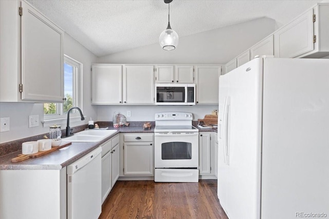 10895 W Bowles Pl, Littleton, CO 80127 - kitchen with white appliances, a sink, vaulted ceiling, white cabinets, and a textured ceiling